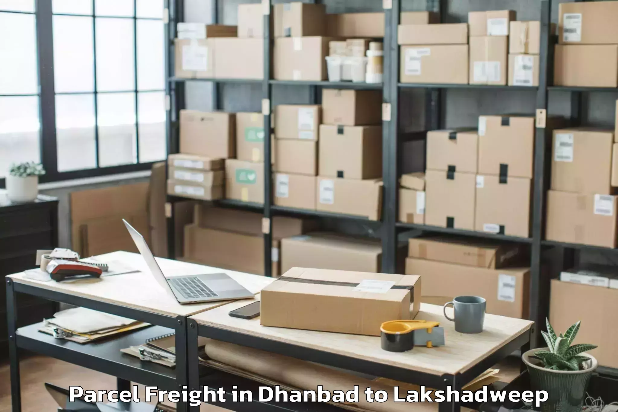 Dhanbad to Kiltan Island Parcel Freight Booking